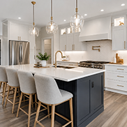 Contemporary kitchen renovation with white cabinets and island